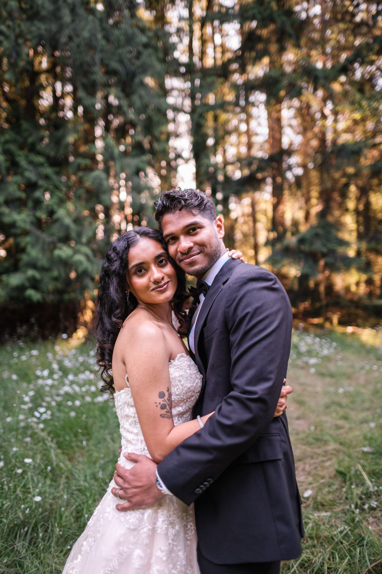 Sreerag and Sanjana embracing in the woods